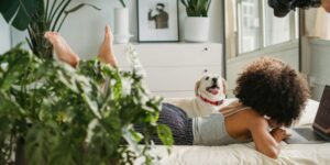 woman with dog on bed